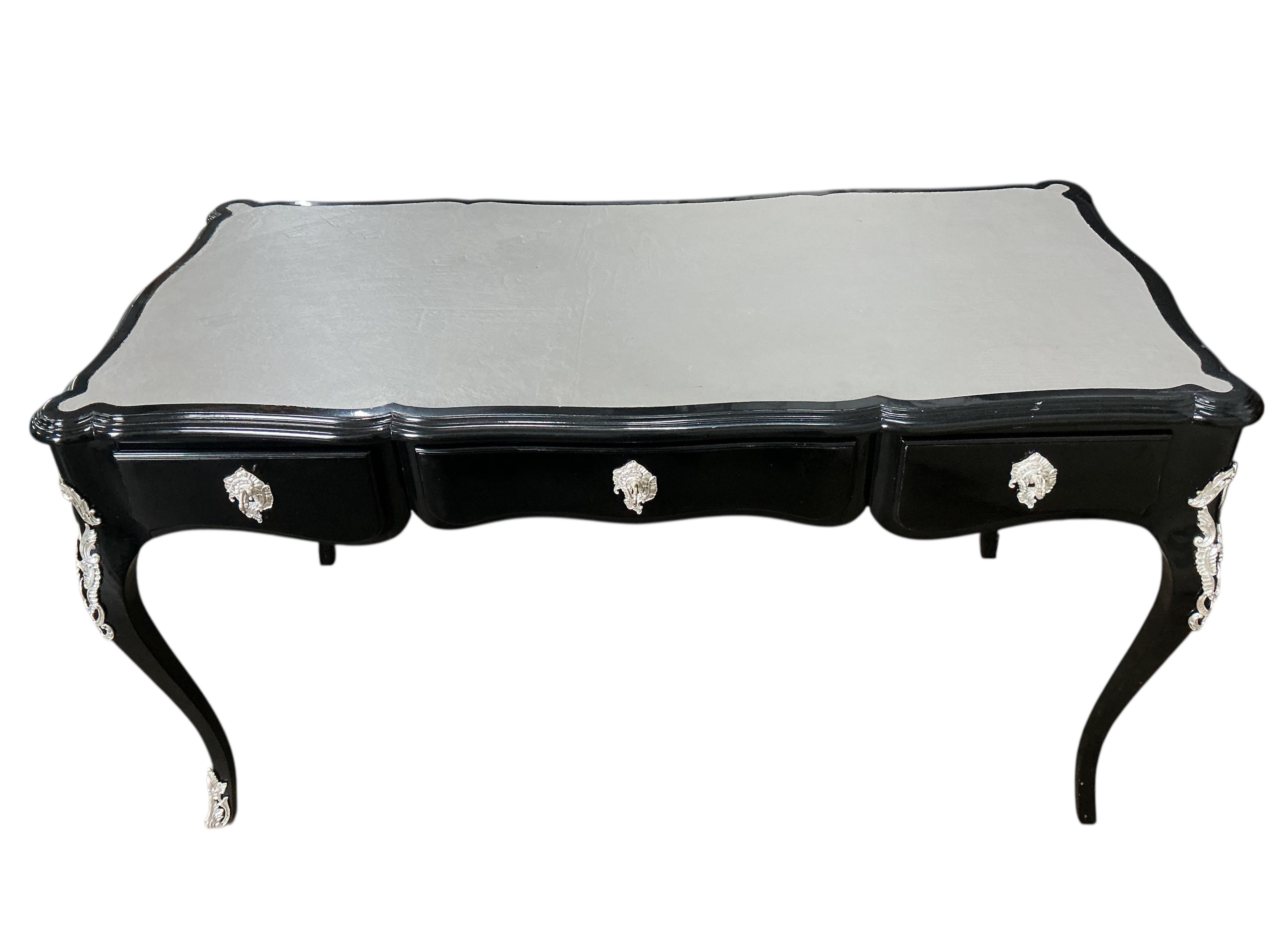 A Contemporary Louis XVI style ebonised bureau plat, width 146cm, depth 71cm, height 79cm